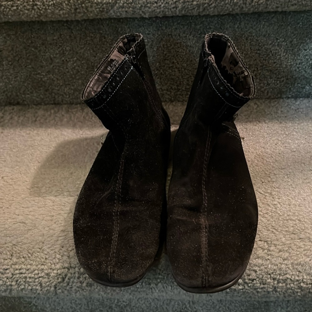 Black suede boots.